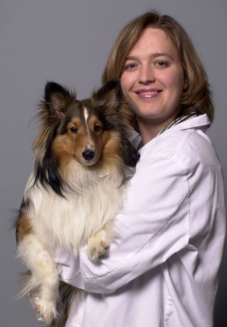 Dr. Corriveau holding a happy dog